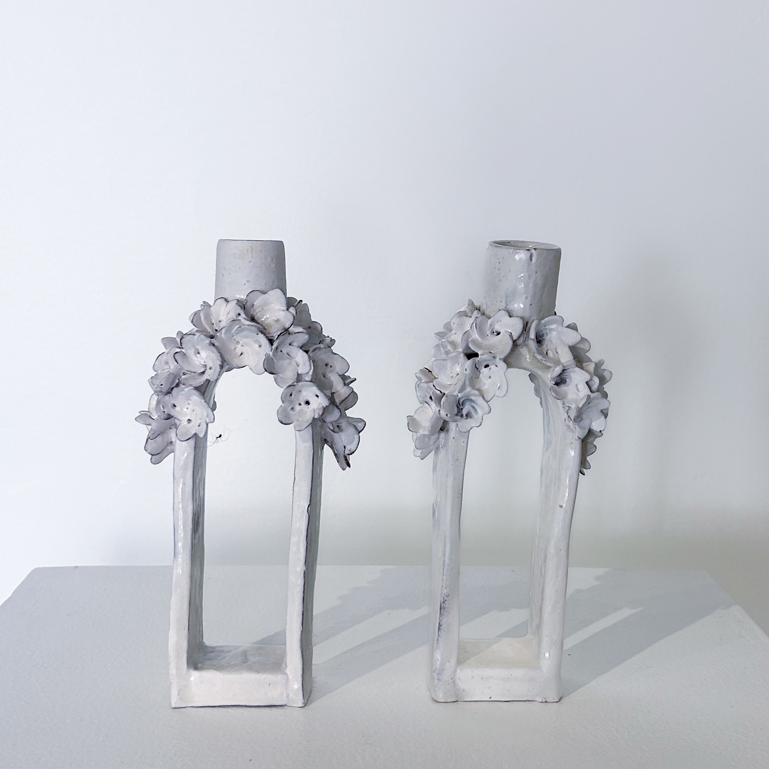 White flower candle pair