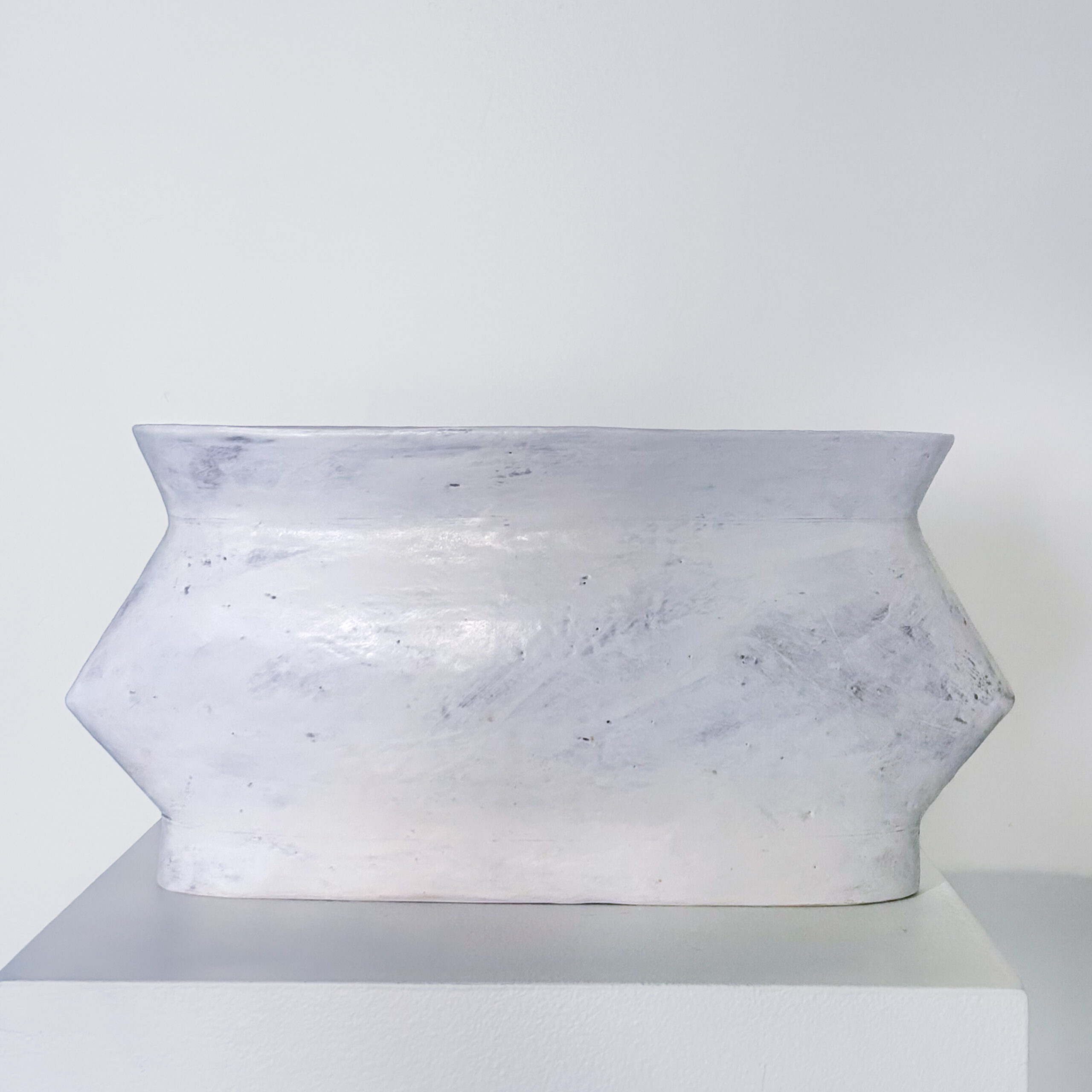 Long low angular vase